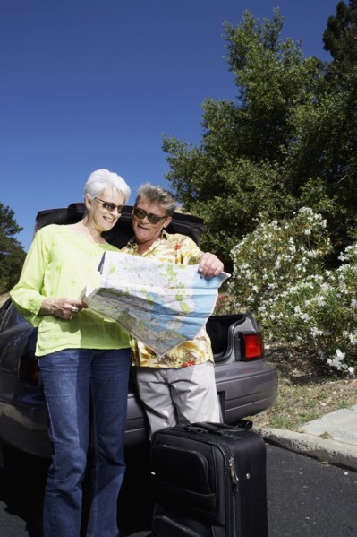 Senior Caucasian couple reading roadmap
