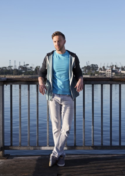 Caucasian man leaning at waterfront