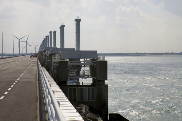 Wind turbines and dam across ocean