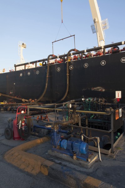 Oil tanker ship docked in industrial harbor