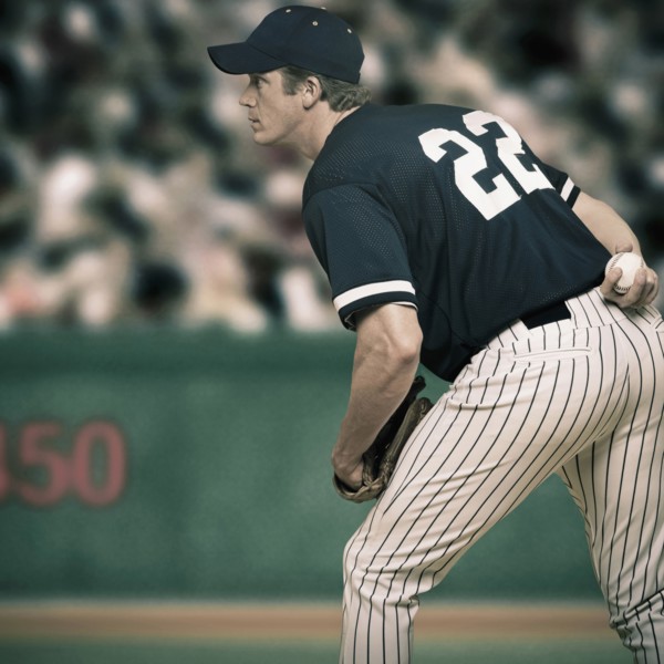 Caucasian baseball player ready to throw ball