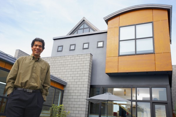 Man standing in front of house