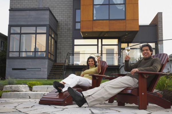 Couple toasting in deck chairs