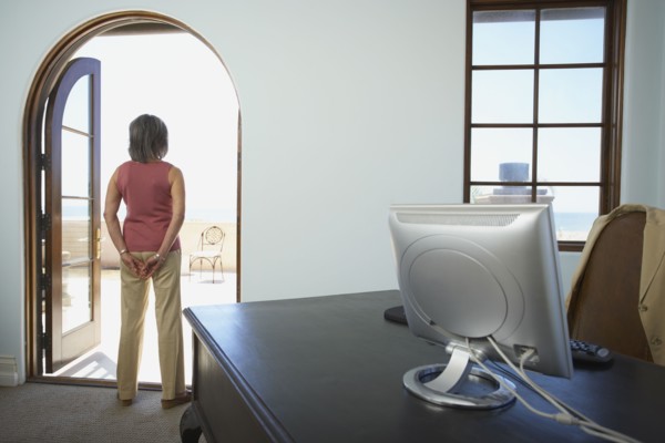 Businesswoman standing in doorway of office