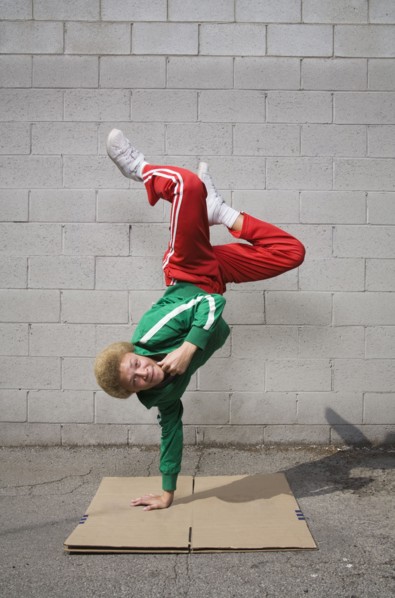 Mixed race boy breakdancing