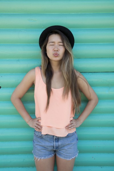 Asian woman blowing a kiss