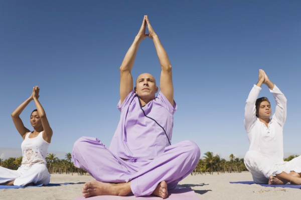 Hispanic people practicing yoga