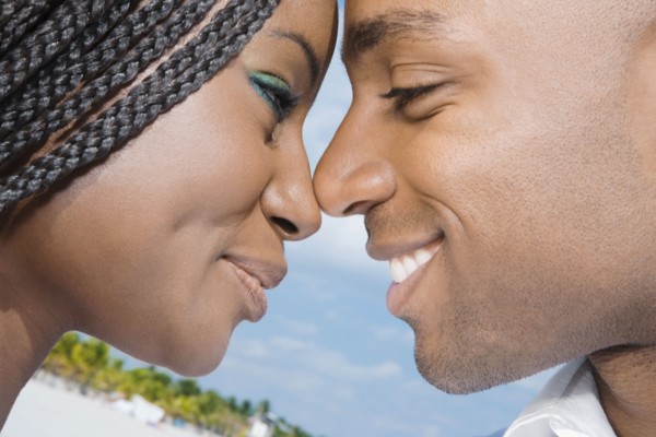 African couple smiling at each other