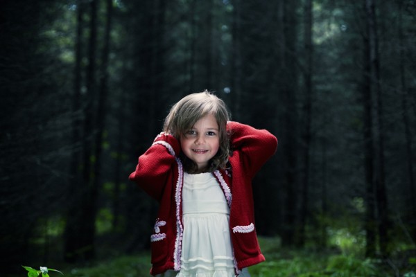 Caucasian girl smiling in forest