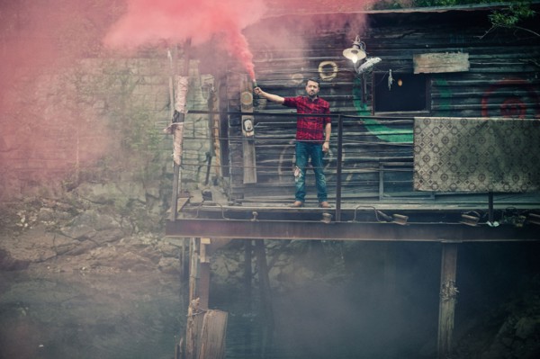 Caucasian man spraying pigment powder