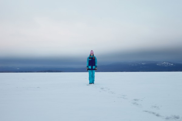 Caucasian teenage girl walking in snow