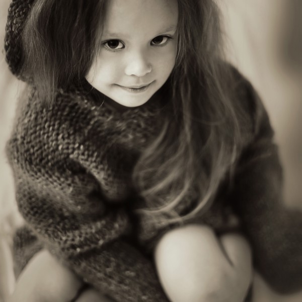 Caucasian girl wearing knitted sweater