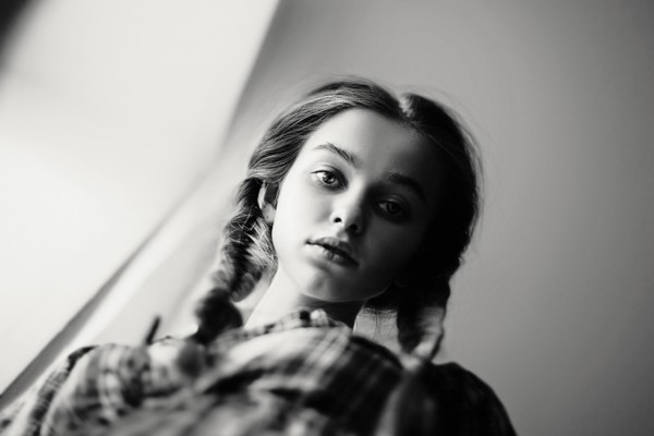 Low angle view of serious Caucasian teenage girl