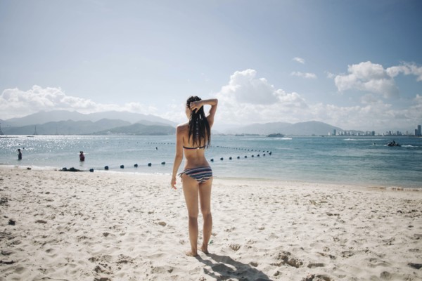 Caucasian woman wearing bikini at beach