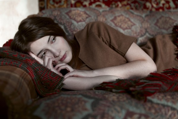 Caucasian woman laying on sofa