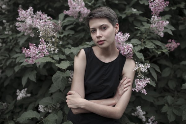 Caucasian woman standing in flowers