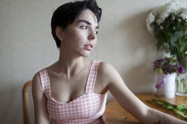 Pensive Caucasian woman sitting at table