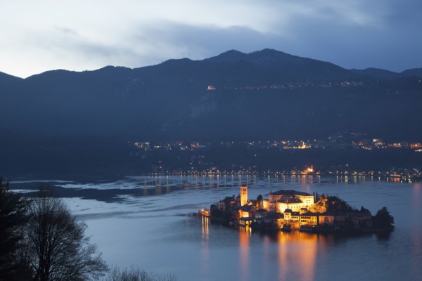 Illuminated island in Italian lake