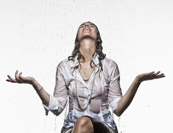 Rain falling on Caucasian businesswoman