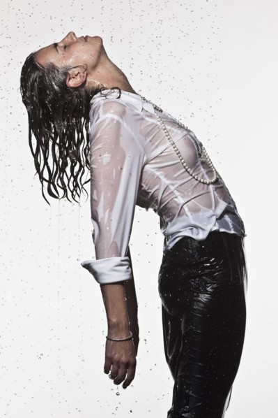 Rain falling on Caucasian businesswoman