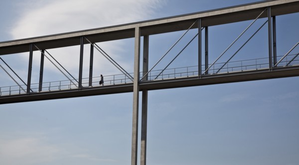Woman walking on skybridge