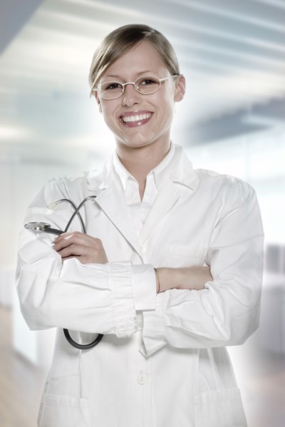 Hispanic doctor smiling in hospital