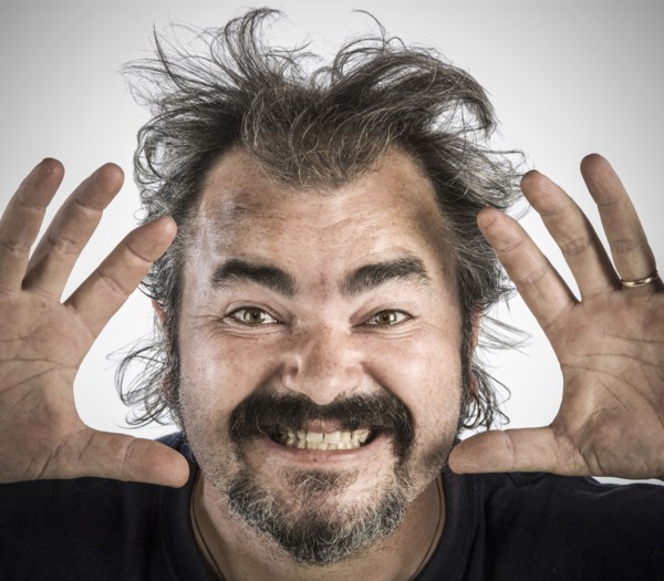 Man with messy hair making face