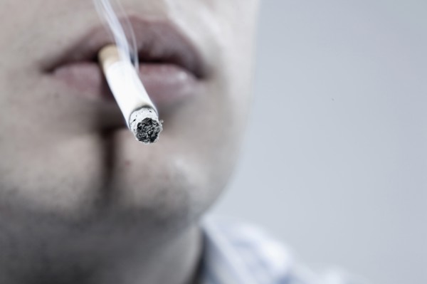 Caucasian man smoking cigarette