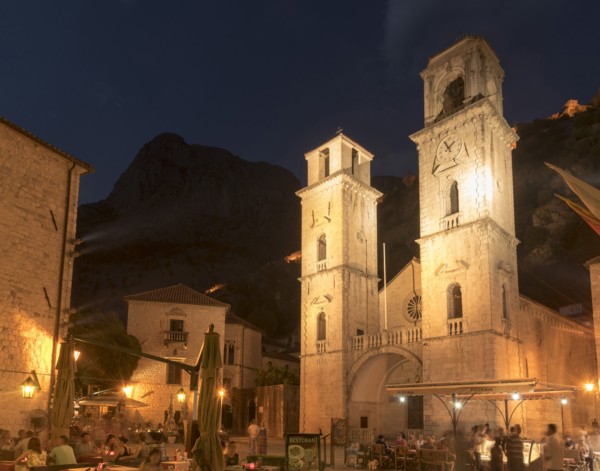 People at outdoor restaurant at night