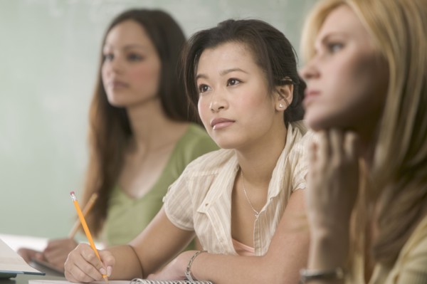 Women taking notes in class