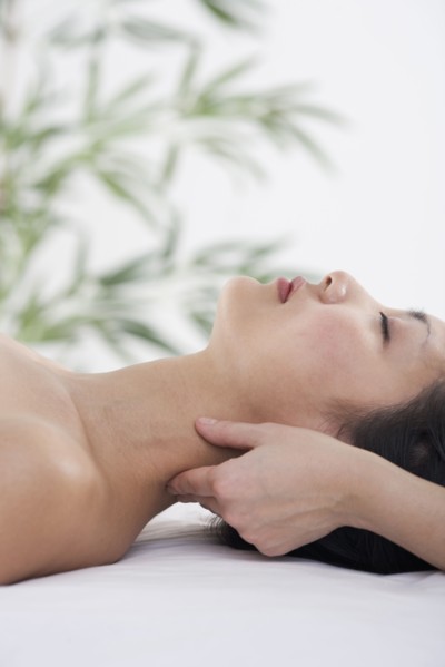Woman receiving neck massage