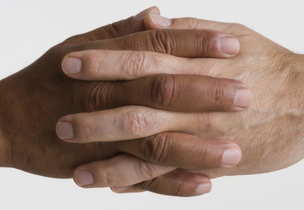 Close up of two hands interlocking