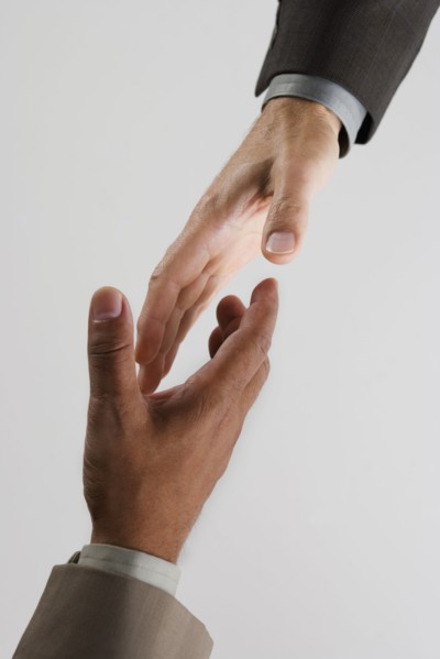 High angle view of businessman's hands shaking