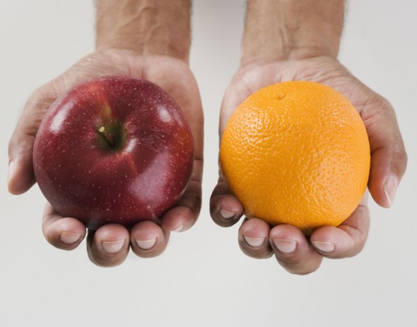 Close up of hands holding two apples