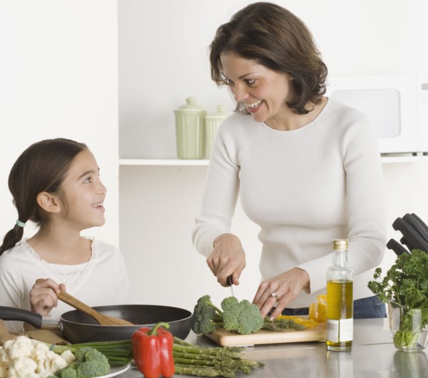Mother and daughter cooking together