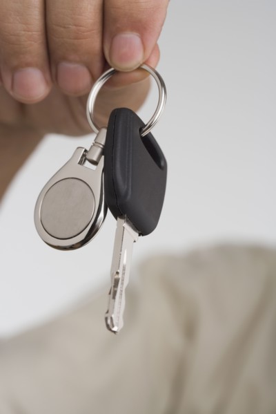 Close up of man's hand holding car key