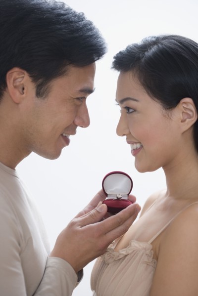 Asian man proposing to girlfriend