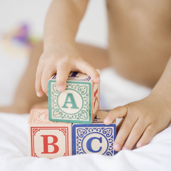 Hispanic baby playing with blocks