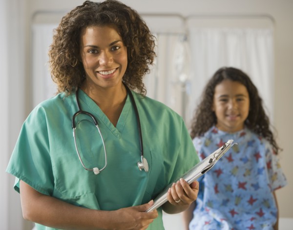African female doctor holding chart