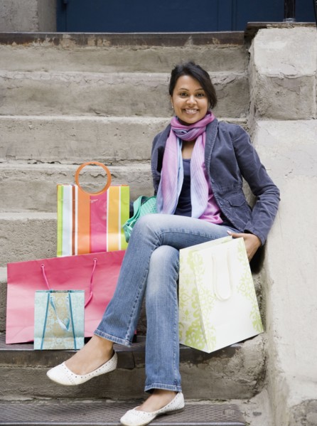 Mixed Race woman with shopping bags