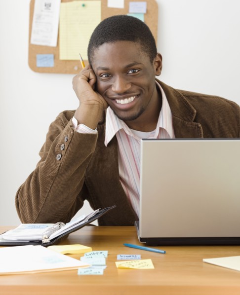 African businessman sitting at desk