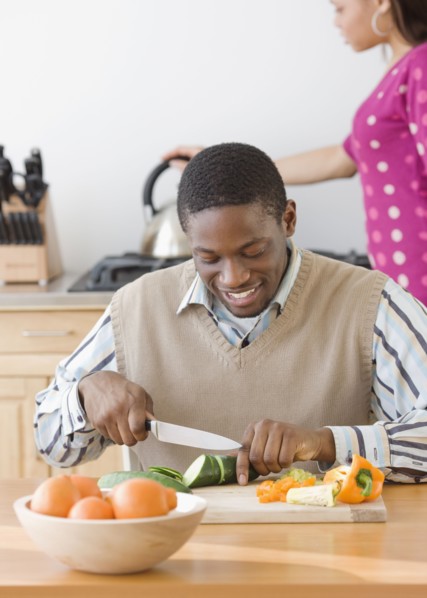 African man chopping vegetables