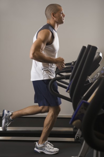 Hispanic man running on treadmill