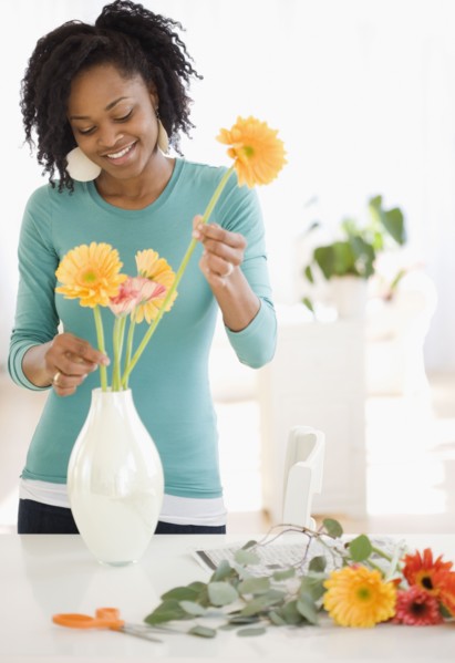 African woman arranging flowers