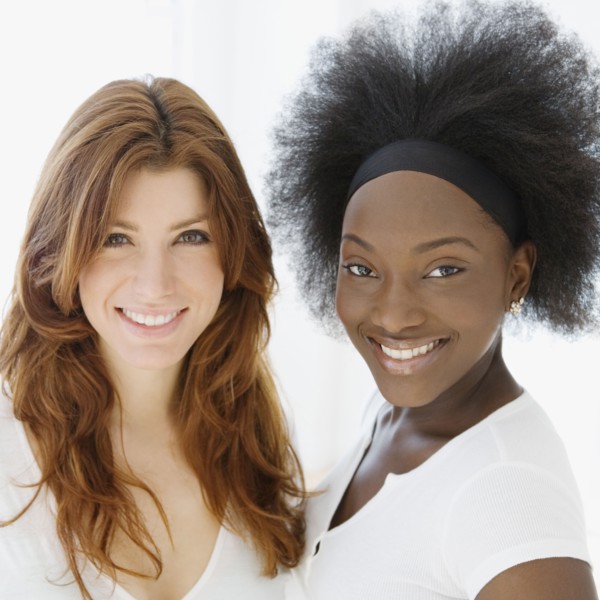 Smiling Caucasian and African woman