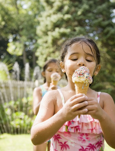 Hispanic girls eating ice cream cones