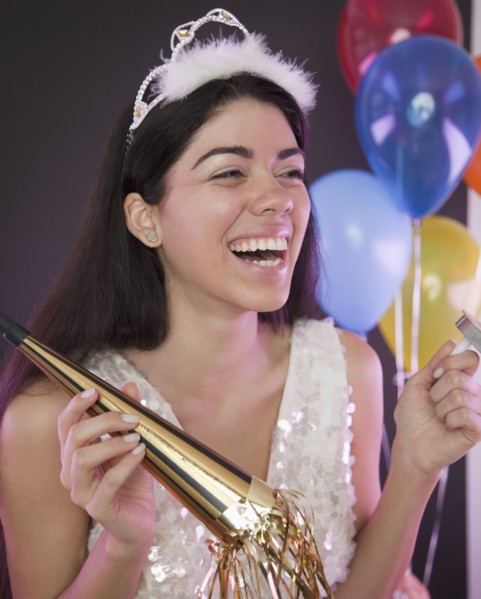 Hispanic woman at New Year's Eve party