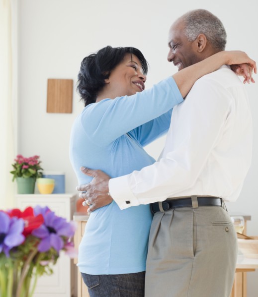 African couple hugging