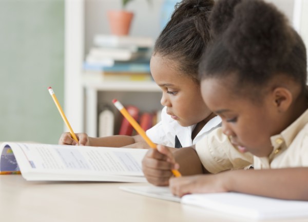 African girls doing homework