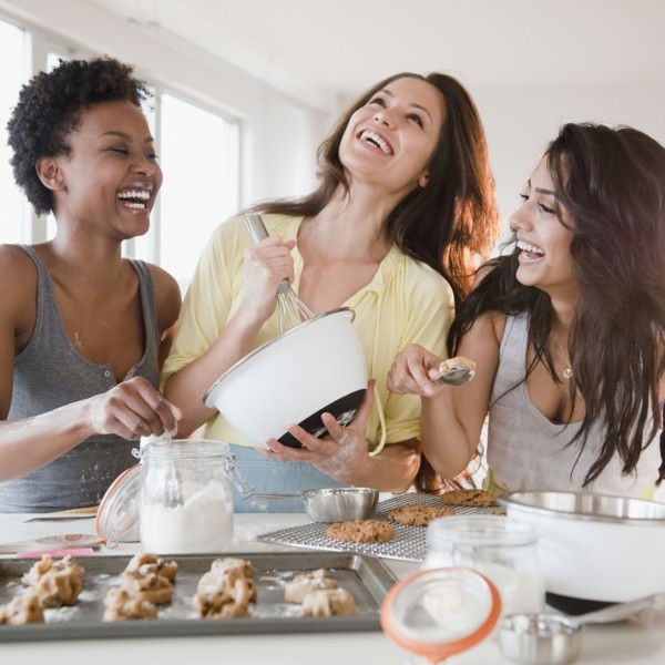 Friends making cookies together